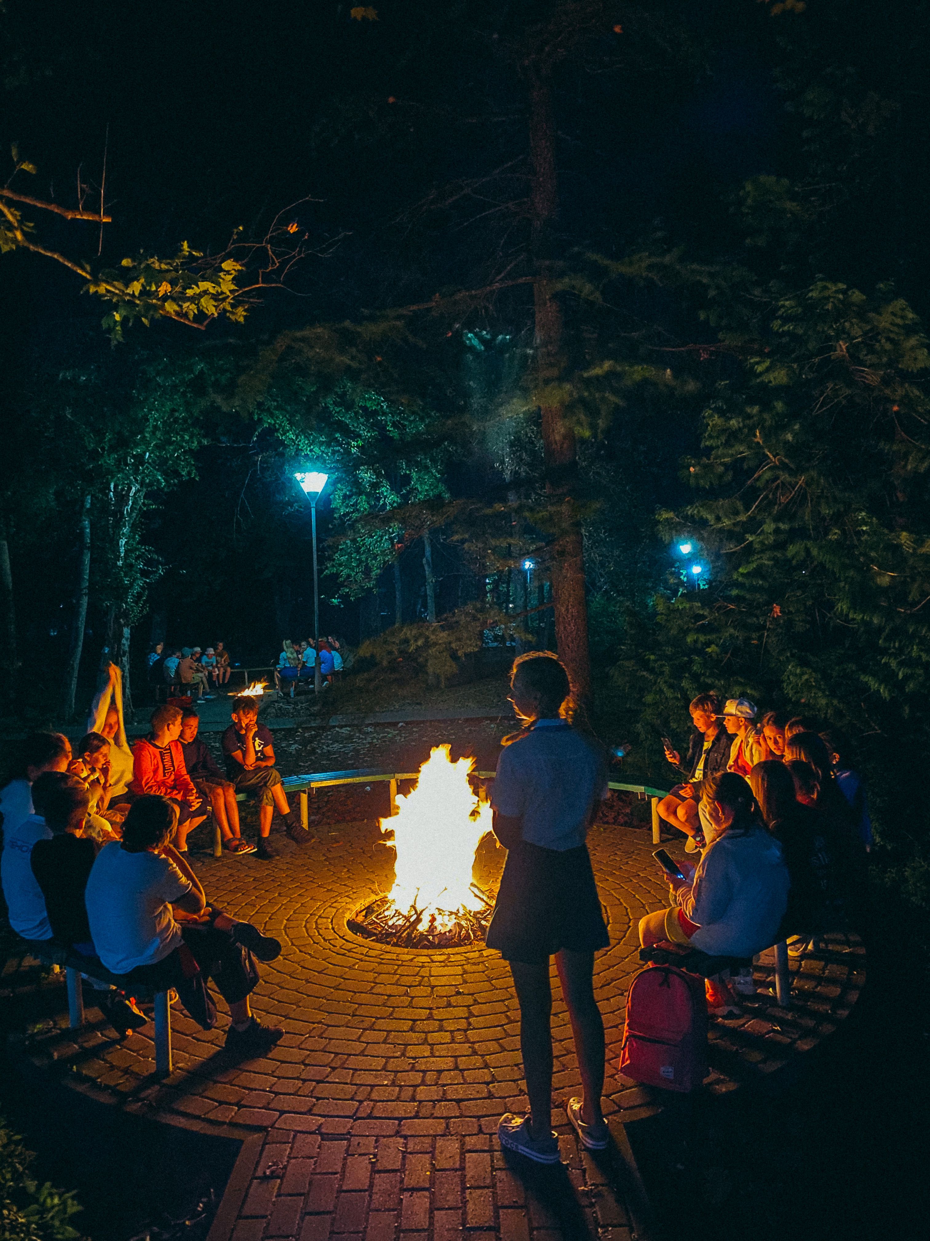 People gathering around a fire pit